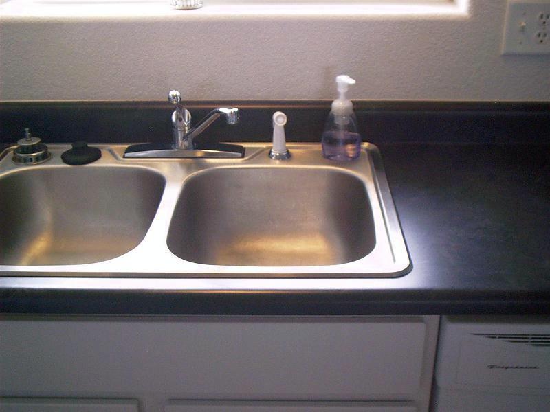 Kitchen Sink, Strip Paint Viola! Prettya and clean. She'll never know